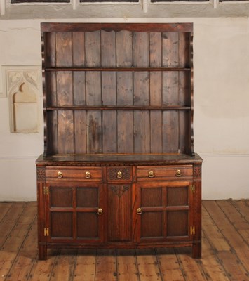 Lot 366 - An antique style carved and panelled oak...