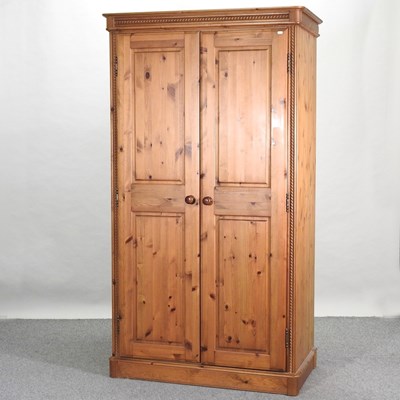 Lot 432 - A modern pine double wardrobe
