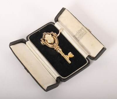 Lot 115 - A silver gilt key, bearing a presentation...