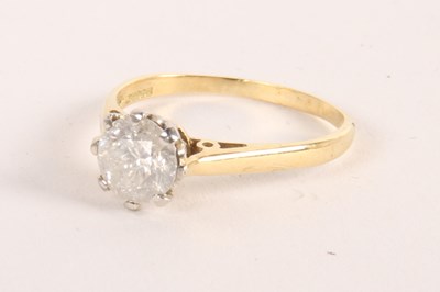 Lot 67 - An 18 carat gold diamond solitaire ring, in a...