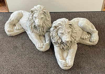 Lot 400 - A pair of large reconstituted stone lions h...