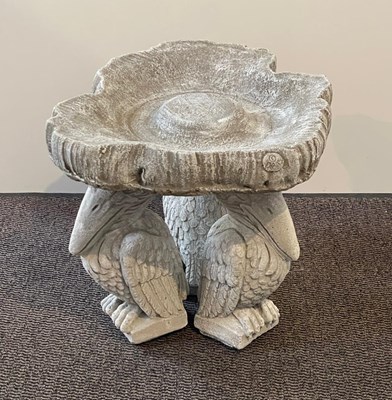 Lot 398 - A reconstituted stone pelican bird bath h 50cm,...