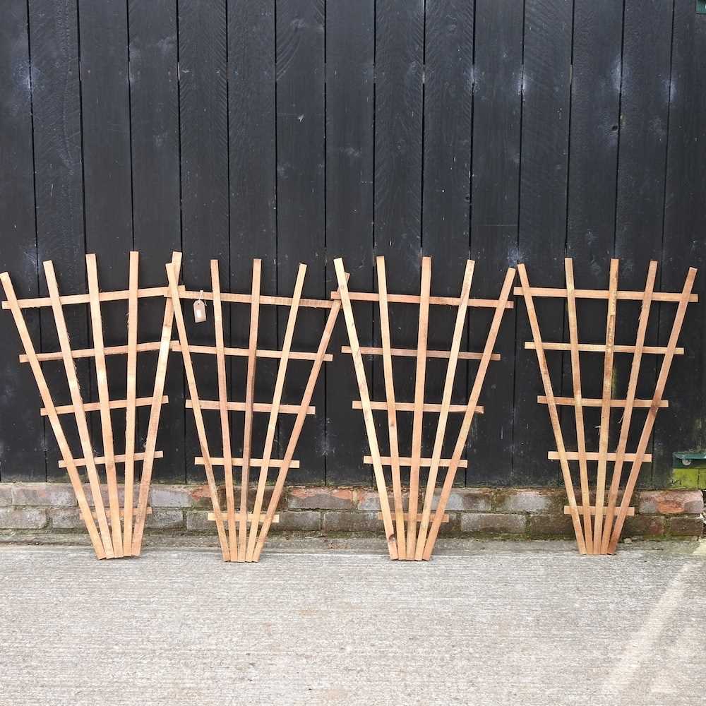 Lot 340 - A set of four fan shaped garden trellis