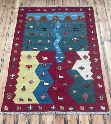 Lot 597 - A Persian Qashgai kilim, decorated with animals