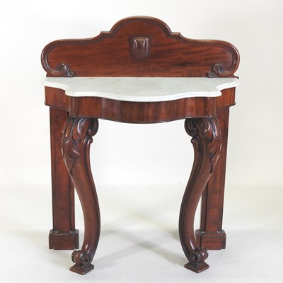 Lot 512 - A Victorian carved mahogany marble top console table