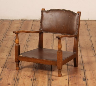 Lot 538 - A 1920s oak framed low armchair
