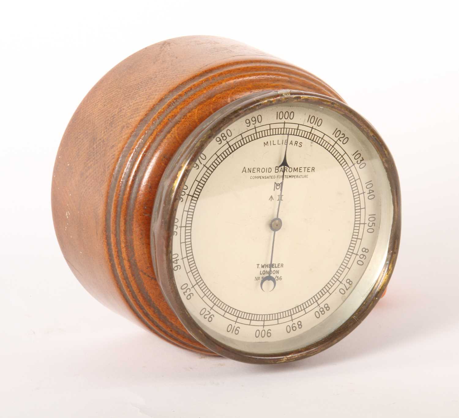 Lot 364 - A Wheeler of London oak desk aneroid barometer,...