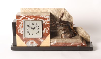 Lot 308 - An Art Deco polished hardstone mantel clock,...