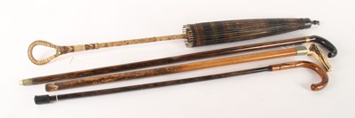 Lot 395 - An early 20th century antler handled walking...
