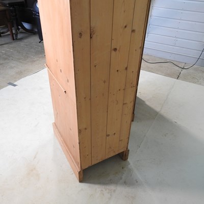 Lot 123 - A pine cabinet, 54cm wide, together with a...