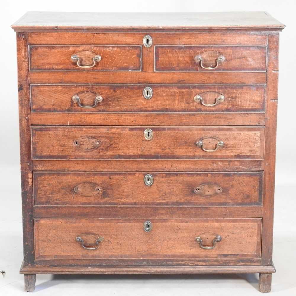 Lot 517 - An 18th century oak mule chest, the hinged lid...