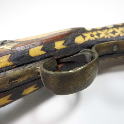 Lot 495 - A middle Eastern flintlock pistol, with bone...
