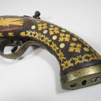 Lot 495 - A middle Eastern flintlock pistol, with bone...