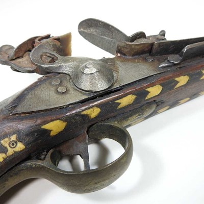 Lot 495 - A middle Eastern flintlock pistol, with bone...