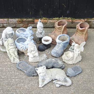 Lot 579 - A collection of cast stone garden ornaments,...