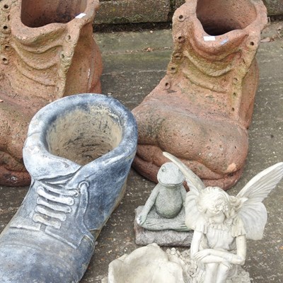 Lot 579 - A collection of cast stone garden ornaments,...
