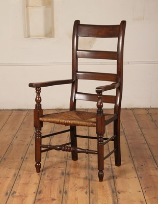 Lot 389 - A 19th century beech rush seated ladder back...