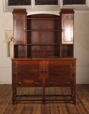 Lot 549 - An early 20th century Arts and Crafts oak...