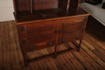 Lot 549 - An early 20th century Arts and Crafts oak...