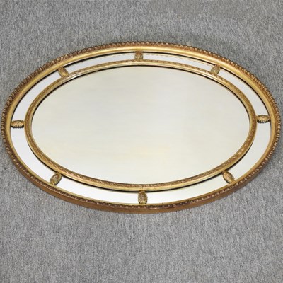 Lot 650 - An early 20th century gilt framed oval wall mirror