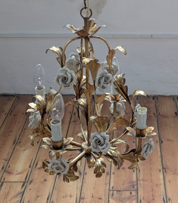 Lot 439 - A gilt metal chandelier, decorated with white...