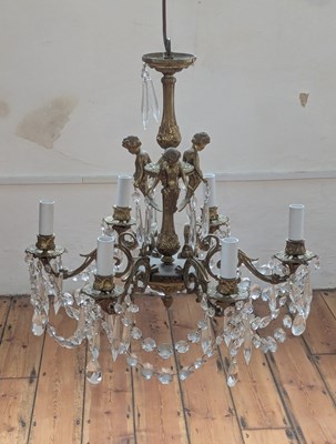 Lot 406 - A gilt metal chandelier, decorated with...