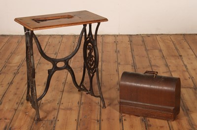 Lot 432 - A Singer sewing machine, with a cast iron...