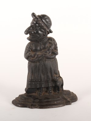 Lot 405 - A cast iron Judy doorstop, 30cm high