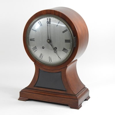 Lot 222 - A large Edwardian mahogany cased balloon shaped mantel clock