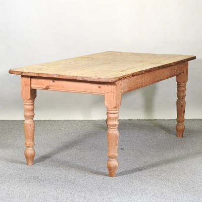 Lot 452 - An antique pine dining table