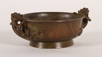 Lot 262 - A Chinese bronze censer, flanked by lizard...