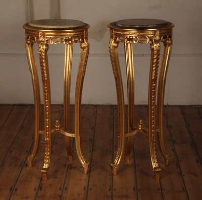 Lot 386 - A pair of gilt tables, each having a polished...