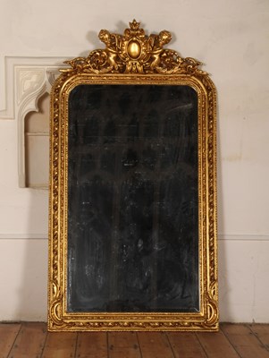Lot 378 - A large ornate gilt framed wall mirror, the...