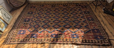 Lot 578 - A large Kelim rug, having geometric decoration...