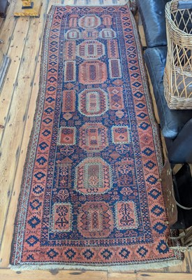 Lot 558 - A Turkish rug, having geometric designs on a...