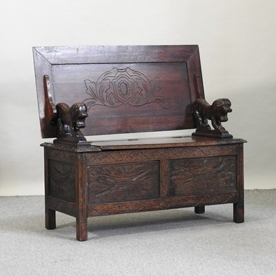 Lot 624 - An early 20th century carved oak monk's bench