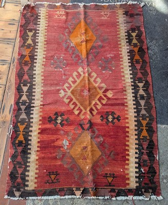 Lot 438 - A Kelim rug, having geometric decoration on a...