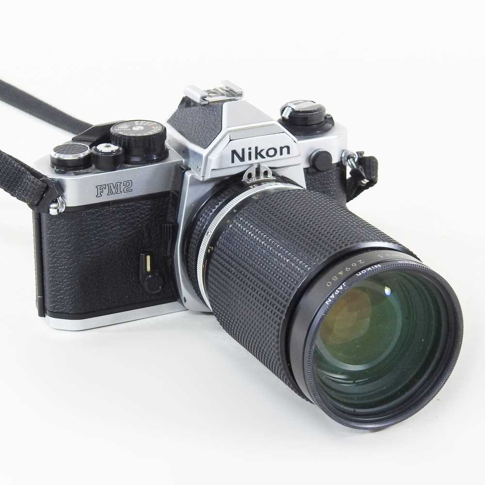 Lot 90 - A Nikon FM 2 camera, with a 35-135mm lens, cased
