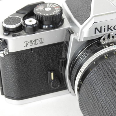 Lot 90 - A Nikon FM 2 camera, with a 35-135mm lens, cased