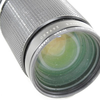 Lot 90 - A Nikon FM 2 camera, with a 35-135mm lens, cased