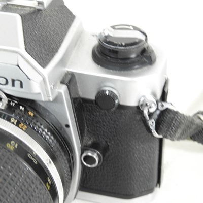 Lot 90 - A Nikon FM 2 camera, with a 35-135mm lens, cased