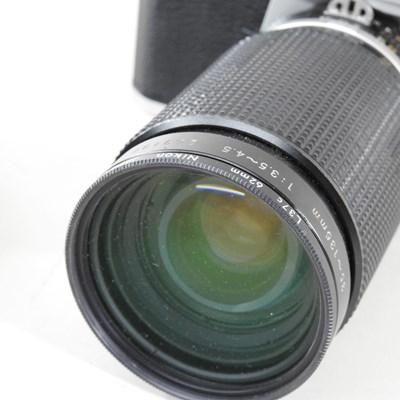 Lot 90 - A Nikon FM 2 camera, with a 35-135mm lens, cased