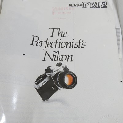 Lot 90 - A Nikon FM 2 camera, with a 35-135mm lens, cased