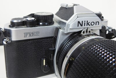 Lot 90 - A Nikon FM 2 camera, with a 35-135mm lens, cased