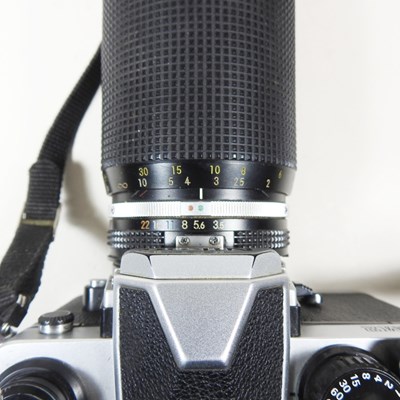 Lot 90 - A Nikon FM 2 camera, with a 35-135mm lens, cased