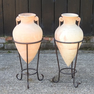 Lot 380 - A pair of terracotta amphora vases