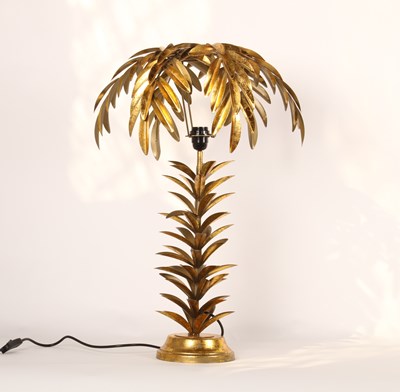 Lot 218 - A gilt metal table lamp and shade, in the form...