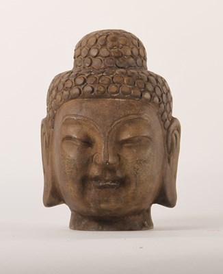 Lot 375 - A carved hardstone Buddha head, 25cm high