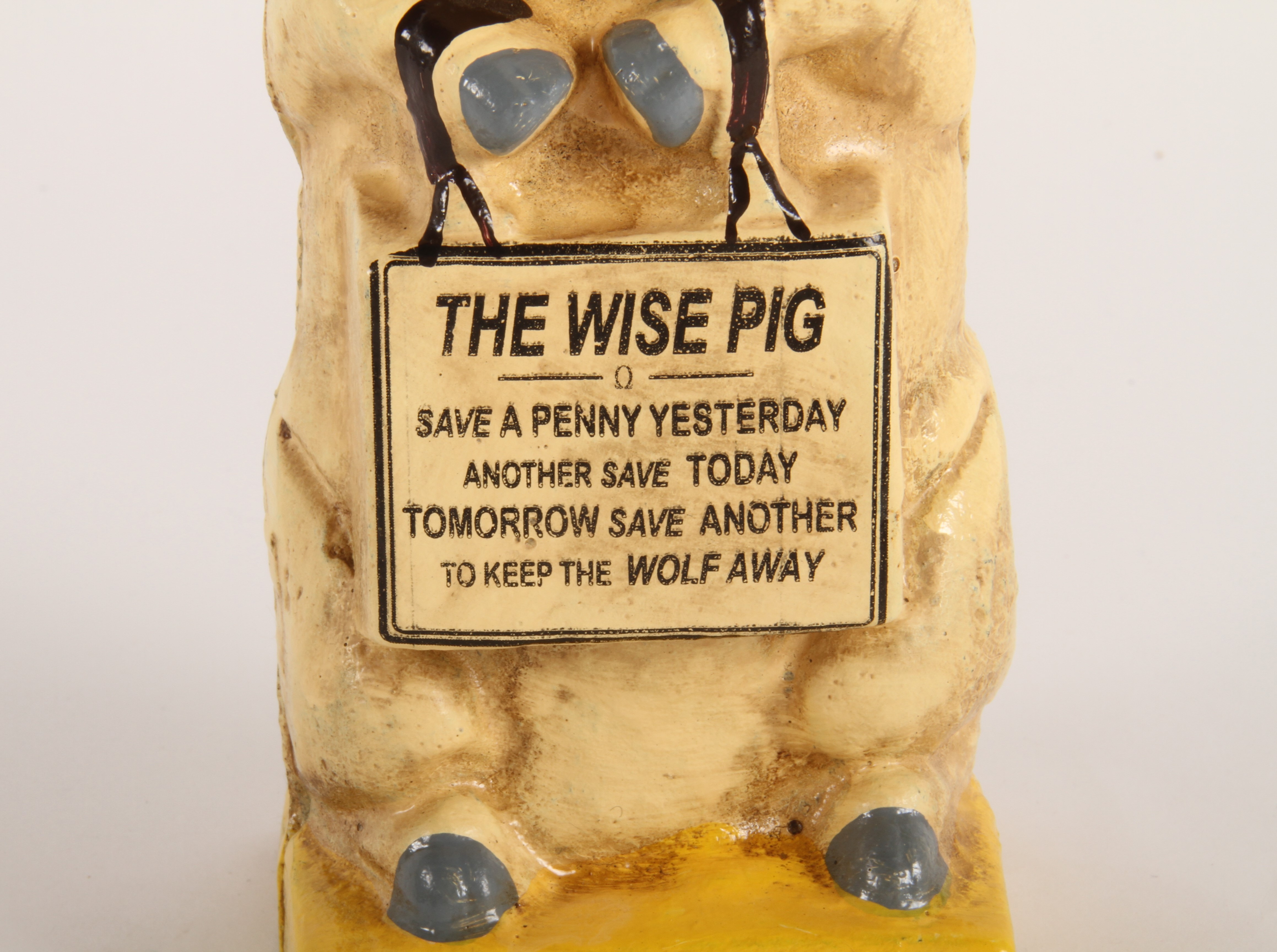 Lot 392 - A painted cast iron The Wise Pig money box,