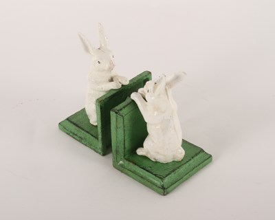 Lot 453 - A pair of painted cast iron rabbit bookends,...